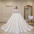 Front full view of the Celestia romantic A-Line wedding dress with off-shoulder neckline and floral lace by EMANY