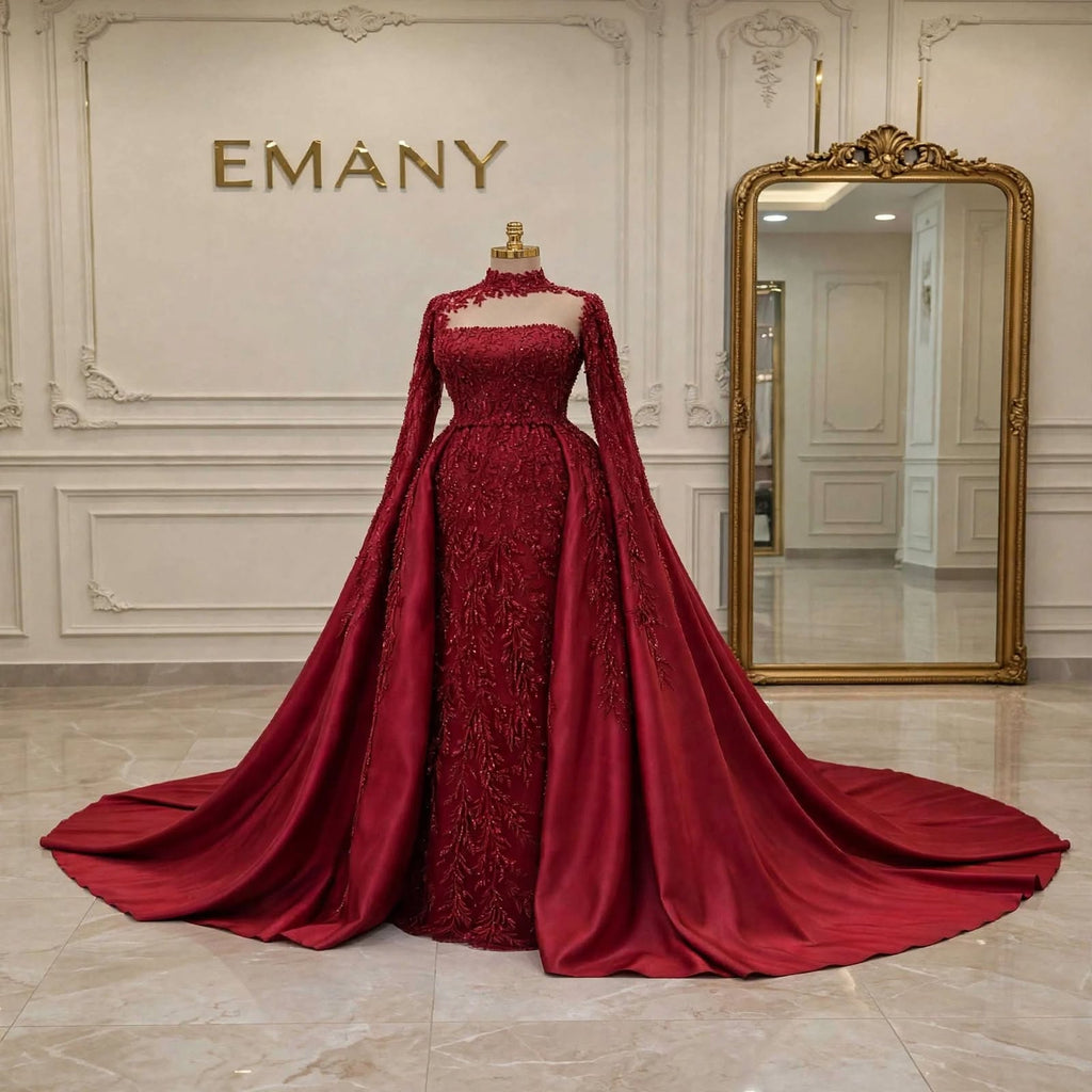 Full front view of the Celestine burgundy gown with the dramatic detachable overskirt.
