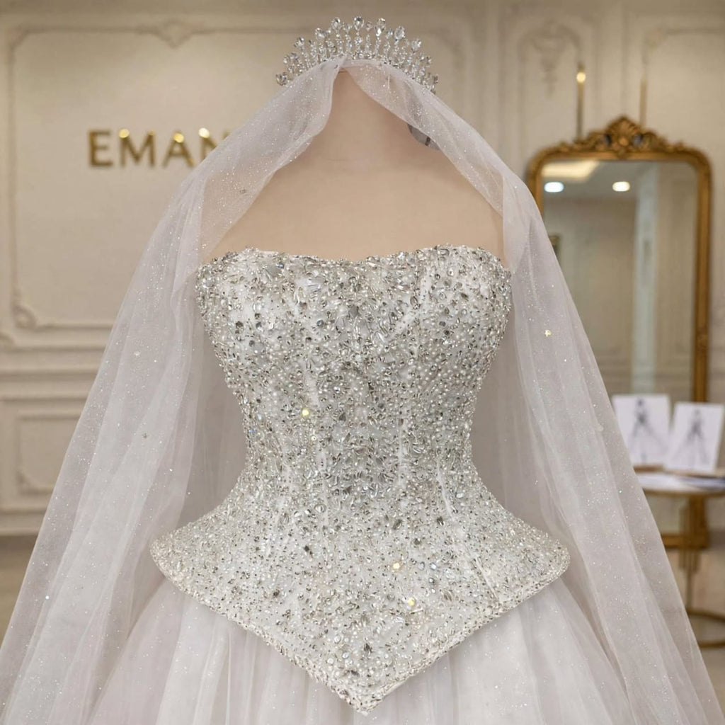 Close-up of the crystal and pearl embellished corset bodice on the Giselle wedding gown by EMANY.