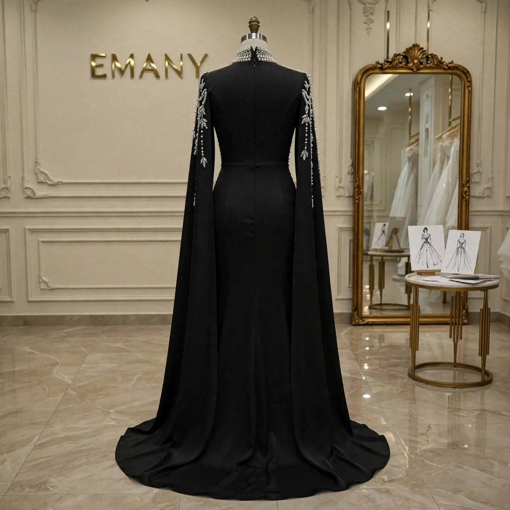 Back view of the Noor Noir black gown, showcasing the fully covered back and elegant train.

