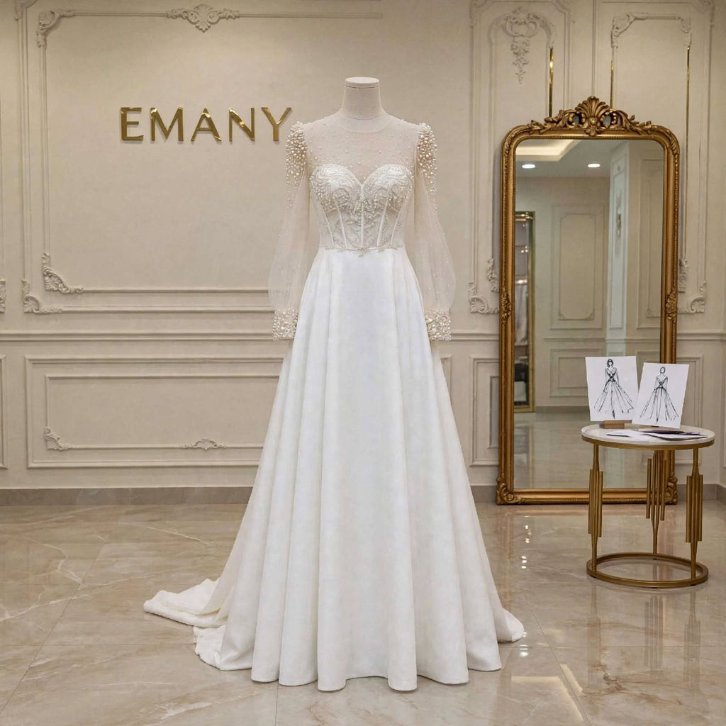 Front full view of the Rosalind modest pearl-embellished A-Line wedding dress with puff sleeves by EMANY.