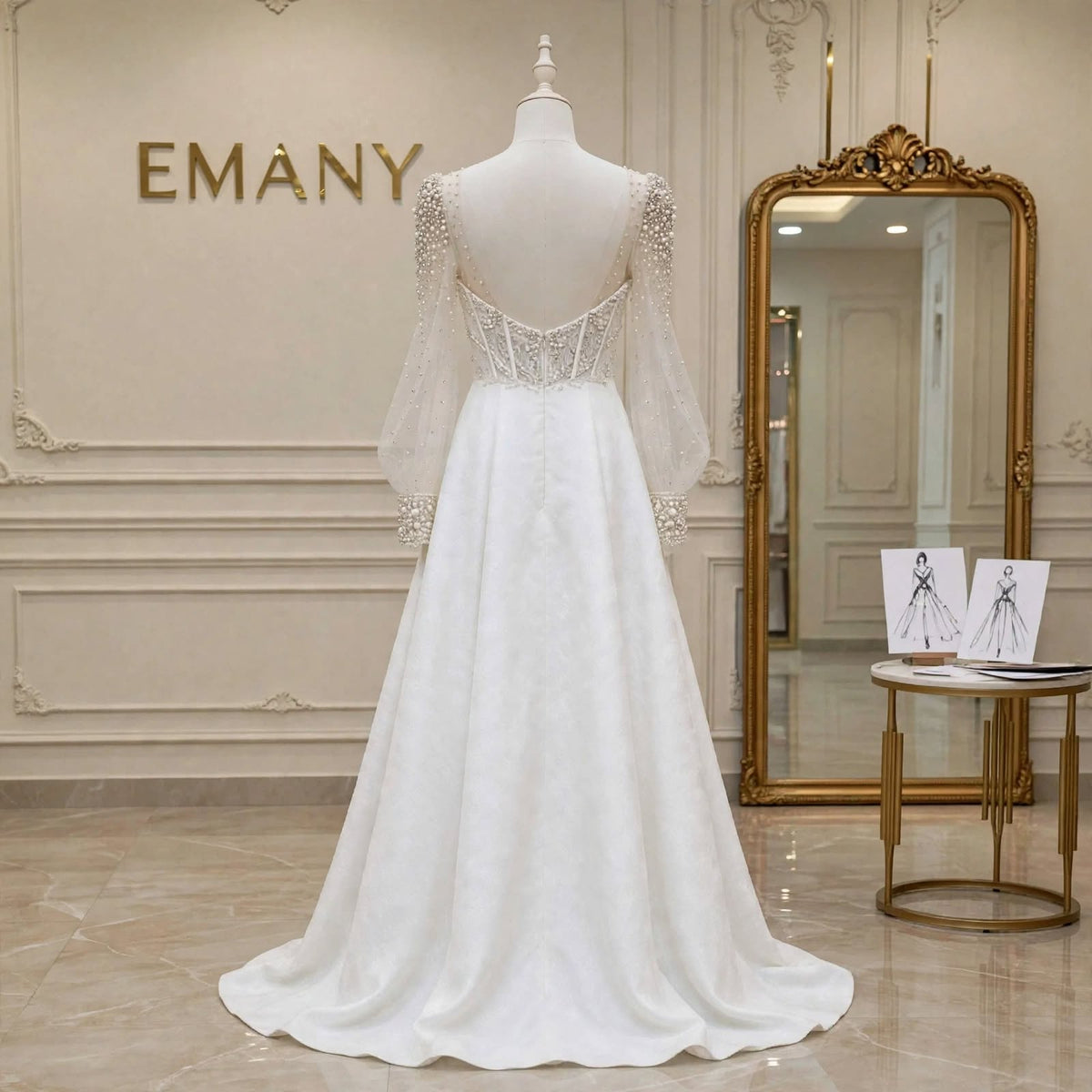 Back view of the Rosalind wedding gown, showcasing the sheer V-back and pearl-detailed buttons.