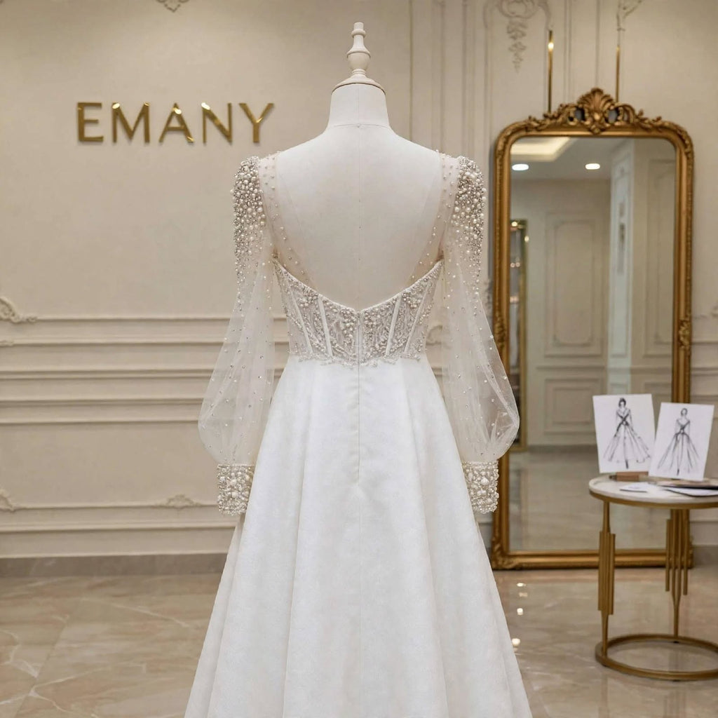 Detailed back view of the Rosalind gown, highlighting the V-back and pearl embellishments.