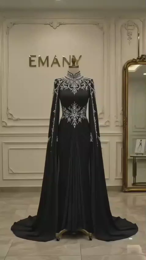 Front full view of the Noor Noir modest black mermaid gown by EMANY with pearl collar and cape sleeves - Video Preview

