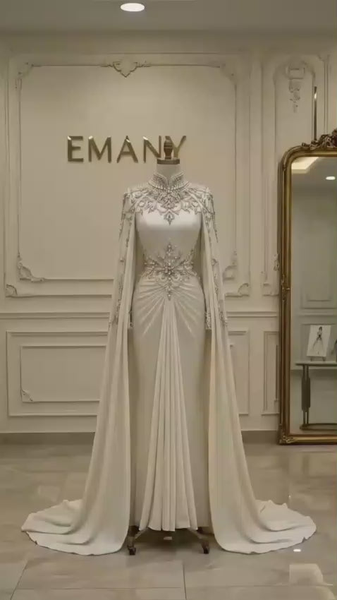 Front full view of the Noor modest ivory mermaid gown by EMANY with pearl collar and cape sleeves - Video Preview

